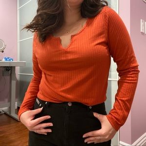 Cropped Orange ribbed long sleeve top with v-neck